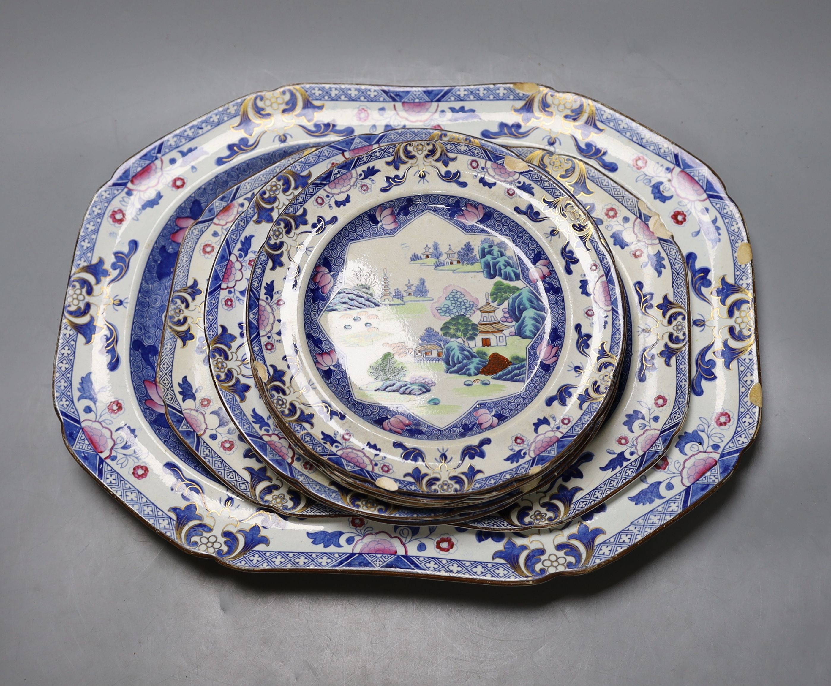 Eight pieces of early 19th century stone china dinnerware, including two graduated meat dishes (some a.f.), meat platter 42 cms wide.